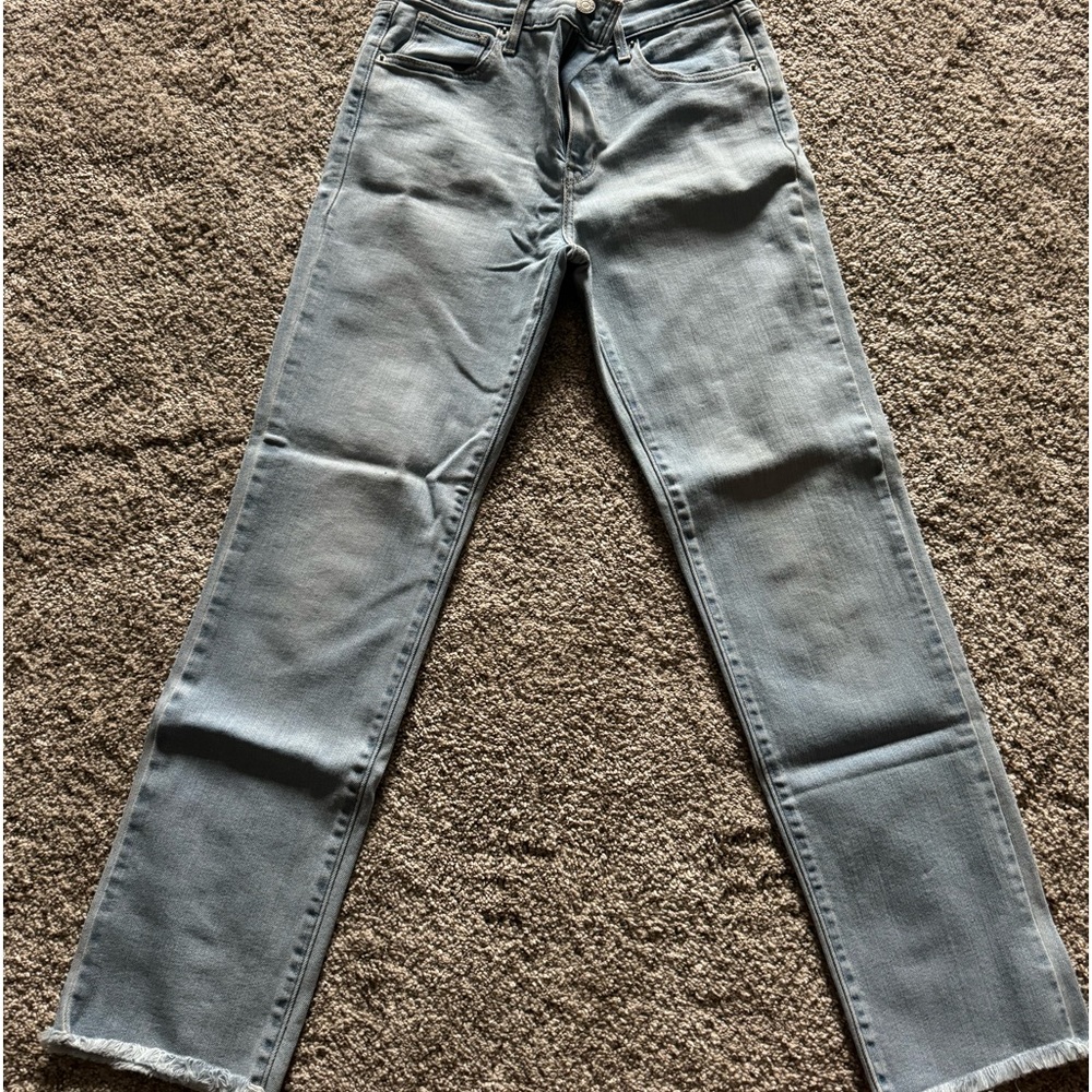 Levi’s cropped light wash fringe jeans